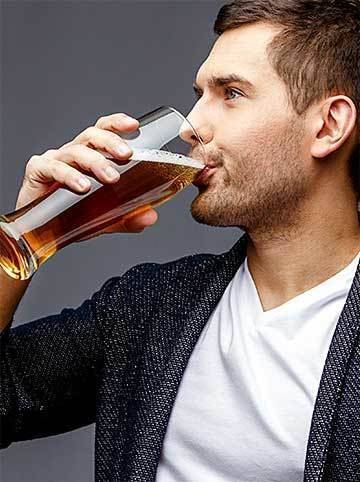 A man tasting beer