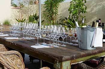 A table with wine glasses lined up