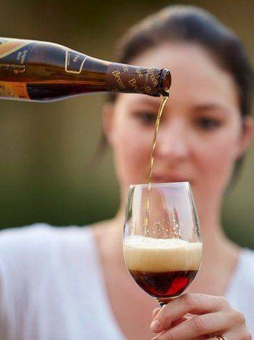 pouring beer into a wine glass